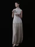Casual styled look of a cheongsam style top with traditional cheongsam collar, sleeveless pinstripe design, and tailored fit, a refined chinese cheongsam top for daily wear and tea ceremonies.