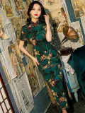 Side view of Old Shanghai short sleeve long cheongsam with deep green floral pattern