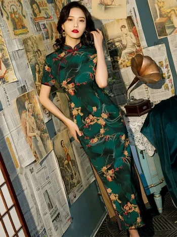 Side view of Old Shanghai short sleeve long cheongsam with deep green floral pattern