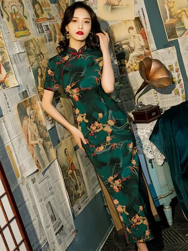 Side view of Old Shanghai short sleeve long cheongsam with deep green floral pattern