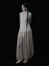 Full body side view of a cheongsam style top with a traditional cheongsam collar, sleeveless pinstripe design, and tailored fit, styled with flowy wide leg pants for a timeless look.