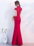 Full back view of a lace qipao dress, showcasing ornate lace detailing on the upper back and a sleek mermaid skirt, designed for red qipao wedding styles.