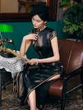 Elegant styled look of a long vintage cheongsam dress, featuring a high slit skirt, classic mandarin collar, and smooth silk-like fabric, perfectly capturing the timeless charm of old shanghai cheongsam dress.