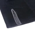 Close-up of side slit on black velvet mini cheongsam dress, soft texture of short qipao fabric