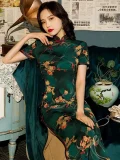 Elegant Old Shanghai short sleeve long cheongsam with green floral print, vintage-inspired look