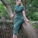 Plus size modern Chinese cheongsam for summer, elegant green floral design for curvy women in garden setting