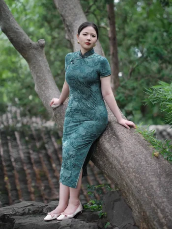 Plus size modern Chinese cheongsam for summer, elegant green floral design for curvy women in garden setting
