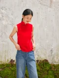 Close-up of red cheongsam blouse, sleeveless modern chinese cheongsam top styled with jeans