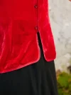Detail shot of red cheongsam blouse, showing traditional buttons on modern cheongsam style top
