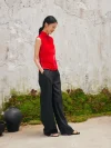 Side view of red cheongsam style blouse, sleeveless chinese cheongsam top paired with black pants