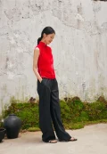 Side view of red cheongsam style blouse, sleeveless chinese cheongsam top paired with black pants