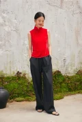 Model in red sleeveless chinese cheongsam blouse, front view of modern cheongsam style top