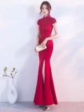 Red lace qipao wedding dress with traditional mandarin collar, lace cap sleeves, and mermaid silhouette with high slit, perfect for Chinese wedding ceremonies and bridal events.