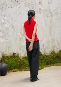 Back view of woman in red sleeveless modern cheongsam blouse, featuring chinese cheongsam style velvet fabric