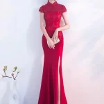 Elegant red wedding qipao with intricate lace bodice, high slit skirt, and classic mandarin collar, a premium choice for modern brides seeking traditional Chinese bridal style.