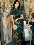 Model in Shanghai style short sleeve long cheongsam with floral print, holding a clutch
