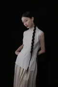 Sleeveless cheongsam collar top in beige pinstripe fabric, featuring a tailored fit and traditional high mandarin collar, a versatile cheongsam style top for everyday styling.