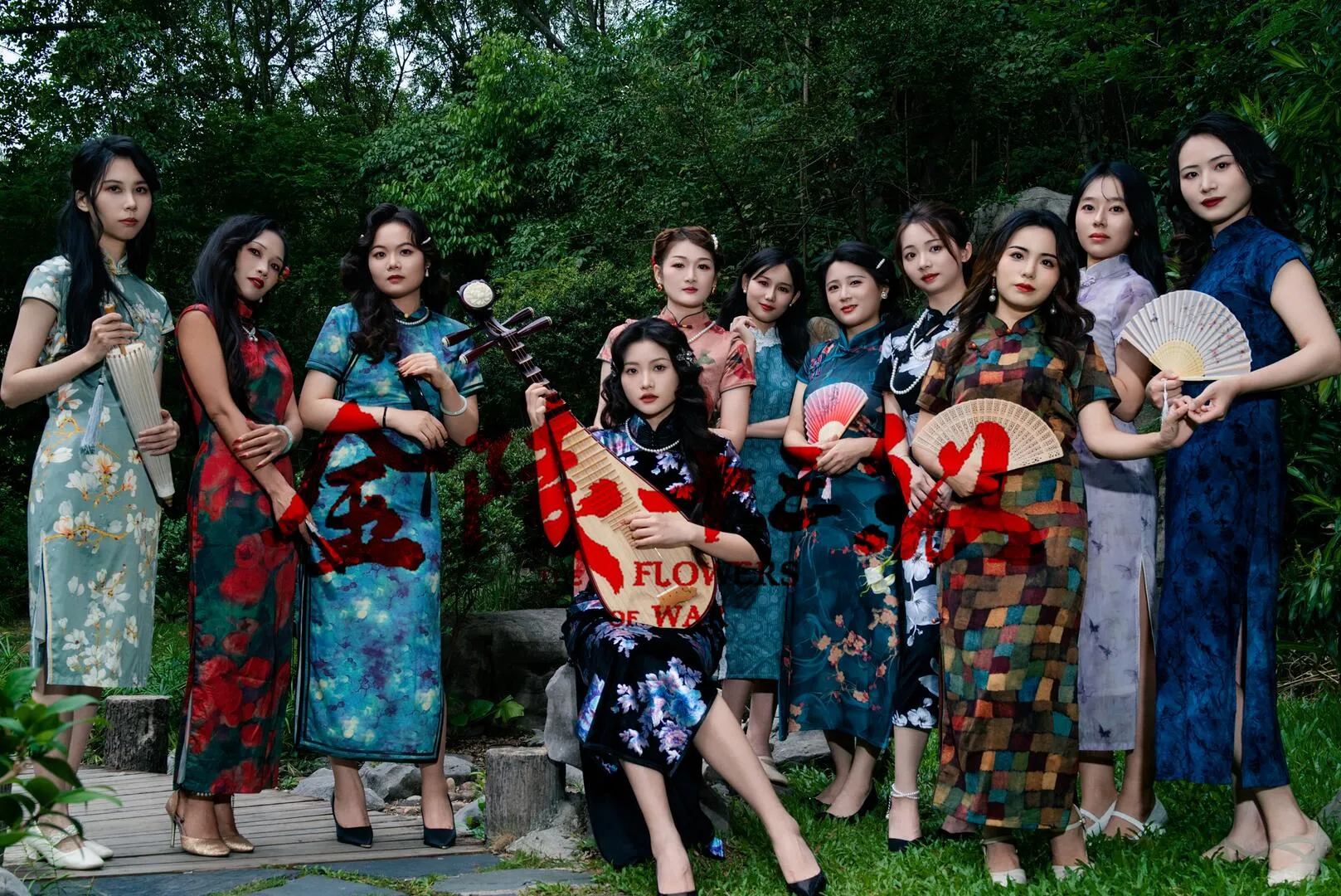 Group of women in vintage minguo style traditional Chinese cheongsam (qipao), holding pipa and folding fans in outdoor chinese garden