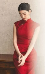 Soft vintage bridal solo portrait of woman in elegant red long wedding cheongsam, traditional chinese mermaid bridal qipao with gentle light effect