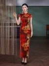 Elegant woman wearing a 19 mome mulberry silk red floral pattern long qipao, standing by beaded curtains in a vintage-style room, showcasing the luxurious silk fabric and traditional cheongsam silhouette.