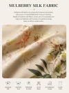 Close-up of premium 19 momme mulberry silk fabric for a printed midi qipao, showing the smooth texture, floral print details, and care instructions for the luxurious material.