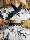 Close-up of 1920s Shanghai-style Chinese silk cheongsam with black lace trim, traditional frog closures, and ink-wash bamboo print, showing front and back collar craftsmanship.