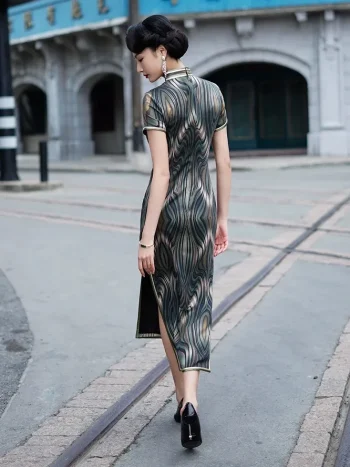 Back view of a woman walking down a vintage street in a dark green brown tone 1930s long mulberry silk qipao, highlighting the dress's flowing fabric and high slit as she moves.