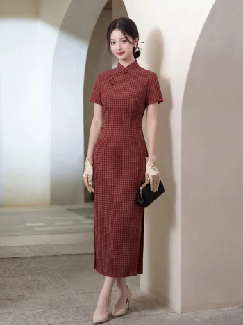 Women's 1940s traditional red plaid qipao, a classic red qipao dress with a subtle checkered pattern, styled with vintage gloves and a black clutch. The model stands in a light-filled archway, showcasing the elegant tailored fit and timeless appeal of this traditional Chinese dress, perfect for vintage-inspired occasions.
