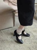 Black 1920s replica cheongsam leather shoes paired with traditional cheongsam and floral lace socks, elegant daily qipao shoes