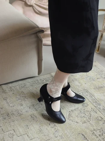 Black 1920s replica cheongsam leather shoes paired with traditional cheongsam and floral lace socks, elegant daily qipao shoes