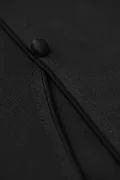 Extreme close-up of the traditional frog button and fine stitching on a black chinese mandarin collar qipao top, highlighting the premium craftsmanship of this modern qipao inspired top.