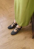 Black floral jacquard leather qipao kitten heel shoes in everyday wear look, Republic of China vintage mary jane style with double cutout straps, paired with long green cheongsam dress for casual traditional style