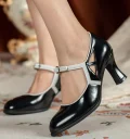 Woman wearing 1920s vintage black patent leather qipao Mary Jane shoes with white contrast trim, paired with a floral white qipao dress.