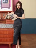 Model wearing a classic black rose print long cheongsam prom dress, elegant women's retro cheongsam with short sleeves and subtle floral jacquard, holding a vintage newspaper in a retro-style room with wooden furniture.
