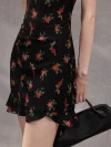 Close-up of the rose print fabric on a black sleeveless short qipao dress, showing the delicate floral pattern and smooth texture of the summer qipao material.