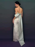Full back view of prom dress qipao, highlighting the dramatic satin bow train and intricate floral jacquard pattern on the form-fitting mermaid gown.