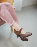 Side view of brown 1920s replica cheongsam leather shoes, elegant cutout qipao shoes worn with pink cheongsam for daily wear