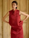 Burgundy Qipao - Close-up of modified two-piece qipao with pants set, showcasing sleeveless mandarin collar brocade top with diagonal pearl frog buttons, highlighting fabric texture and tailored fit