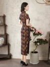Back view of women's vintage checkered long cheongsam, a short sleeve high slit qipao with a geometric plaid pattern in brown, burgundy, and navy. The model stands indoors, showing the neat tailoring and elegant back design of this classic Chinese dress.