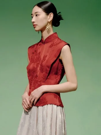 Side profile shot of a model wearing a cheongsam top modern style, a women's red chinese slim fit jacquard cheongsam top, highlighting the clean lines and structured fit.