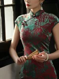 Close-up detail shot of the classic traditional chinese cheongsam dress, highlighting the elegant mandarin collar, traditional frog buttons, and intricate red floral and phoenix patterns on this velvet qipao traditional dress, emphasizing its premium craftsmanship and timeless design.
