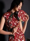 Close-up shot of a woman wearing a red crane print cotton cheongsam dress, focusing on the traditional frog buttons, intricate crane and wave pattern, and matching decorative tassel accessories.