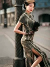 Woman in a dark green brown tone 1930s long mulberry silk qipao leaning against a vintage street lamp, holding a feather fan, showcasing the dress's elegant curves and high slit in a retro Shanghai setting.
