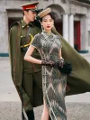 Elegant woman in a dark green brown tone 1930s long mulberry silk qipao, posing with a man in vintage military uniform, showcasing the dress's high collar, frog buttons, and classic 1930s silhouette in a retro Shanghai street setting.