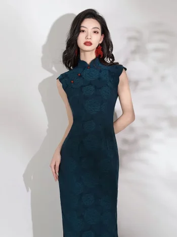 Front view of elegant women's dark green qipao with rose jacquard pattern, cap sleeves, red frog buttons and high slit, model standing against white background.