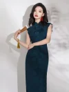 Full view of women's elegant dark green high slit qipao with rose jacquard and red buttons, model holding a Chinese folding fan, traditional cheongsam dress.