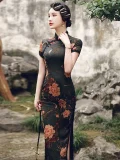Elegant woman in a stone garden, wearing a high slit peony cheongsam dress with a dark floral print and traditional frog buttons, embodying the timeless charm of Old Shanghai fashion.