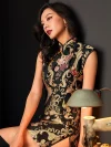 Elegant woman seated in a studio, wearing a fashion black and gold embroidered short qipao dress with intricate floral and baroque-style embroidery, showcasing the mandarin collar, tassel details, and luxurious texture of this black embroidered qipao.