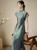 Full-body shot of women's green modified qipao dress, short sleeve floral pattern cheongsam with 3D cut flower craft, showing the slim fit silhouette and side slit design in soft green fabric