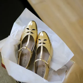 Gold vintage genuine leather T strap high heel qipao sandals, neatly placed in a shoebox with white tissue paper, highlighting the premium leather texture and classic cutout details, perfect as a retro gift option